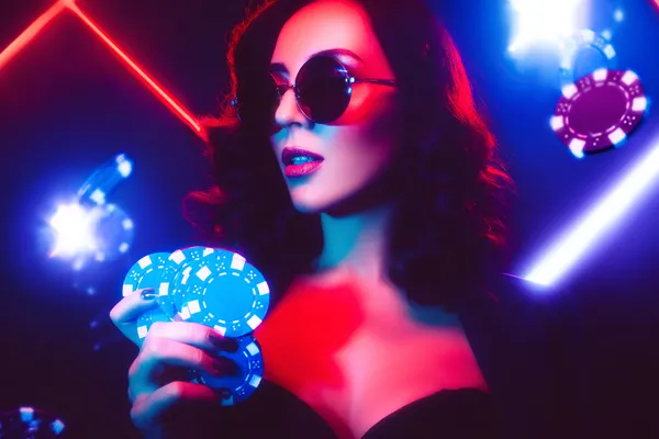 KKDB Mobile Casino — Play anytime, anywhere A player using their smartphone during a festive local event, representing KKDB’s fully mobile-friendly casino.