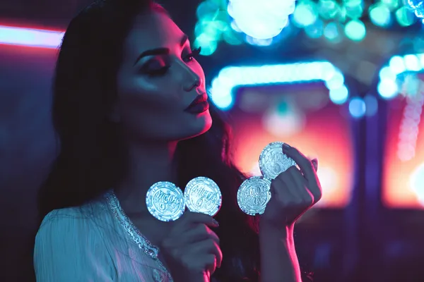 KKDB Member Login — Return to your personalized dashboard A person using their device against a moody casino-themed background, illustrating the smooth re-entry process at KKDB.